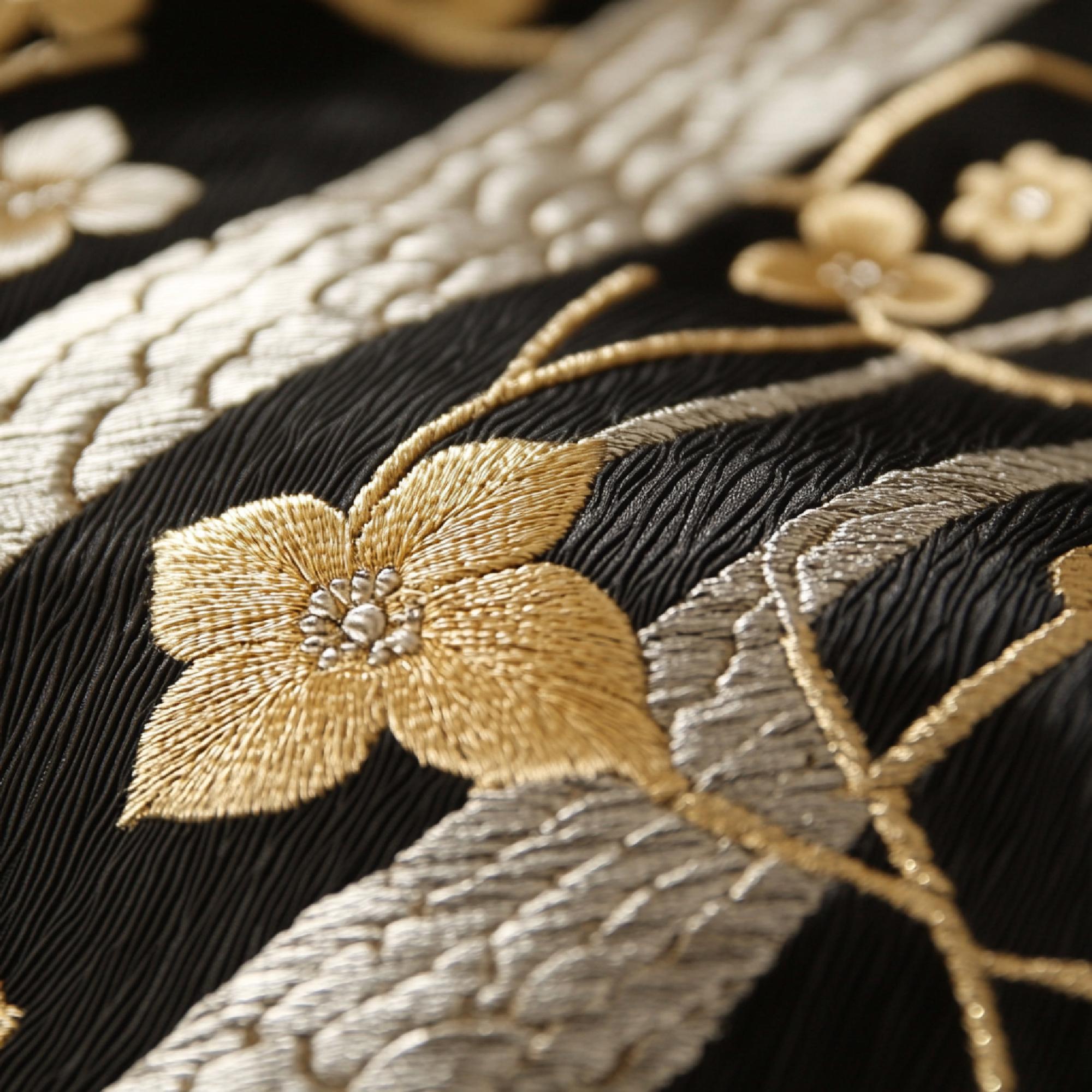 Close-up of gold thread embroidery on silk